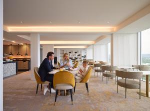 a rendering of a restaurant with people sitting at a table at RACV Royal Pines Resort Gold Coast in Gold Coast