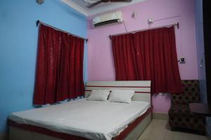 En eller flere senger på et rom på Hotel Bidisha 2