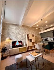 Khu vực ghế ngồi tại Appartement à deux pas des arènes de Nîmes +1 ảnh