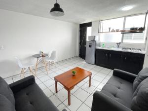 Kuchyň nebo kuchyňský kout v ubytování Departamentos H72