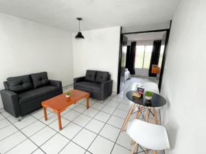 Posezení v ubytování Departamentos H72 + 9 fotografií