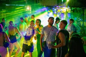 eine Gruppe von Menschen, die auf einer Party tanzen in der Unterkunft Base Ao Nang Beachfront Party Hostel 18-35 Years Old Only in Ao Nang Beach