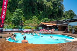 eine Gruppe von Menschen in einem Schwimmbad in der Unterkunft Base Ao Nang Beachfront Party Hostel 18-35 Years Old Only in Ao Nang Beach