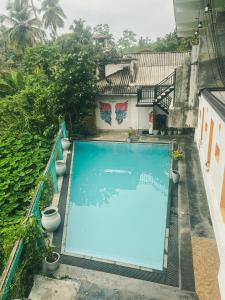 an overhead view of a swimming pool in a building at Leyon Paradise Hotel in Unawatuna