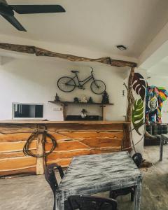 a room with a table and a bike on the wall at Leyon Paradise Hotel in Unawatuna