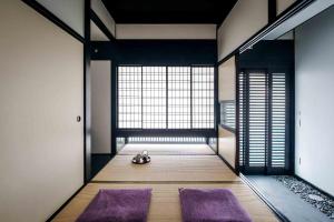 Ein Bett oder Betten in einem Zimmer der Unterkunft Shobu an Machiya House