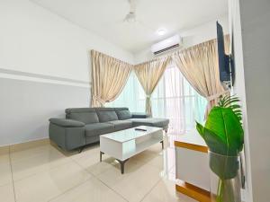 a living room with a couch and a table at Razak City 2 or 3 bedroom KLCC View Sungai Besi, Kuala Lumpur in Kuala Lumpur