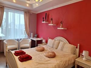 a bedroom with a bed with two pumpkins on it at B&B Sandra in Alūksne