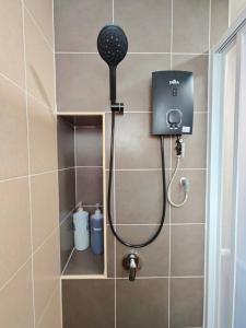 a shower with a shower head in a bathroom at Razak City 2 or 3 bedroom KLCC View Sungai Besi, Kuala Lumpur in Kuala Lumpur