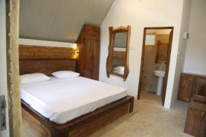 Säng eller sängar i ett rum på Bambaragala Eco Lodges