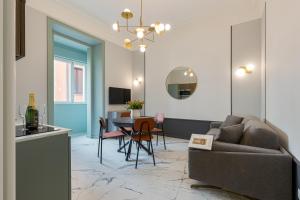 a living room with a couch and a table at The Romulus in Rome