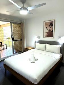 Ένα ή περισσότερα κρεβάτια σε δωμάτιο στο Beachfront Apartment Sunshine Coast