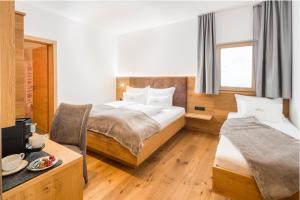Katil atau katil-katil dalam bilik di Hotel Regnum Zegg