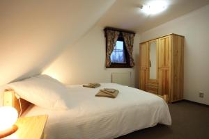 Un pat sau paturi într-o cameră la Drevenice Zuberec