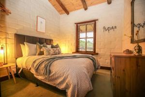 Ένα ή περισσότερα κρεβάτια σε δωμάτιο στο Feathertop Retreat