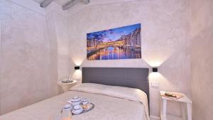 Postel nebo postele na pokoji v ubytování Mulino La Pietra