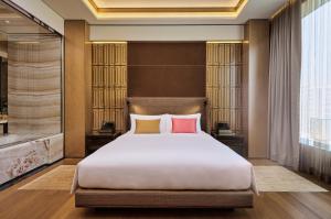 Ένα ή περισσότερα κρεβάτια σε δωμάτιο στο MGM Cotai
