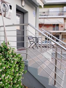 a metal railing on a balcony of a building at Black Eagle Apartment in Drama
