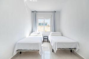 A bed or beds in a room at Casa Las Calas