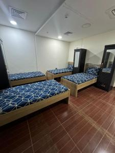 a group of three beds in a room at Metro Single beds boys room next to Union Metro Station in Dubai