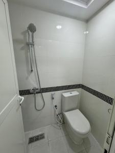 a bathroom with a toilet and a shower at Metro Single beds boys room next to Union Metro Station in Dubai