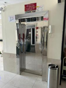 a display case in a building with utensils at Metro Single beds boys room next to Union Metro Station in Dubai