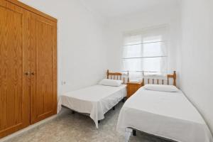 A bed or beds in a room at Casa Las Calas
