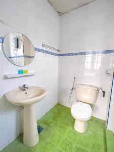 a bathroom with a white toilet and a sink at The Little Star Hotel & Studio at Star Regency Residence in Brinchang