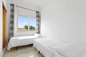 A bed or beds in a room at Casa Las Calas