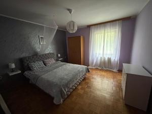 מיטה או מיטות בחדר ב-Šumska kuća Juga Kovačević