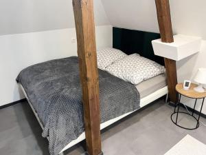 a bedroom with a bunk bed and a table at Mini Villa in Alfeld Leine in Alfeld