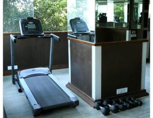 a counter with a mirror and a treadmill at Hotel Ans International, Raigarh, in Raigarh