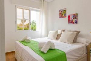 Posteľ alebo postele v izbe v ubytovaní Apartamento Pink Summer + 26 fotografií