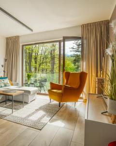 Et opholdsområde på Apartament IGA z basenem i saunami KARKONOCE Stone Hill - centrum