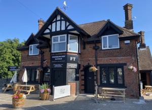 a store front of a brick building at The Fishmongers Tavern in Sheringham
