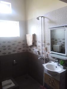 a bathroom with a sink and a mirror at Family guest house in Rawalpindi