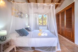 Postel nebo postele na pokoji v ubytování Finca AGUILA by Mallorca Villa Selection