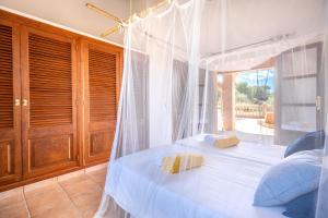 Postel nebo postele na pokoji v ubytování Finca AGUILA by Mallorca Villa Selection
