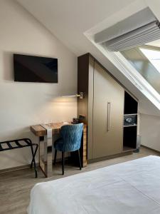 Postel nebo postele na pokoji v ubytování Hôtel du Théâtre, Boutique Hôtel