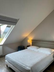 Postel nebo postele na pokoji v ubytování Hôtel du Théâtre, Boutique Hôtel