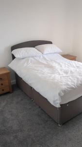Postel nebo postele na pokoji v ubytování Coronation Mill Apartment
