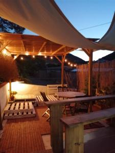 a patio with chairs and a table and an umbrella at Cavo Beach 5 in Cavo