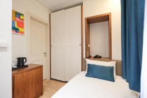 Postel nebo postele na pokoji v ubytování Golden City Hotel , Tirana