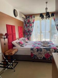 a bedroom with a large bed and a window at Luxury Premium przy samym Morzu Plaży in Primorsko