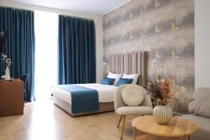 Postel nebo postele na pokoji v ubytování Golden City Hotel , Tirana