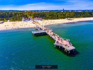 an aerial view of a pier on a beach at Kawalerka Nad Morzem II in Gdańsk