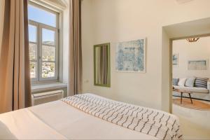 Postel nebo postele na pokoji v ubytování Hydra Hotel