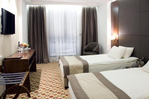 Кровать или кровати в номере Central Hotel Sofia