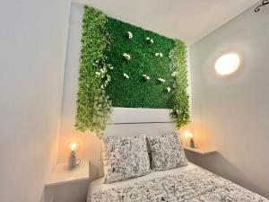 Łóżko lub łóżka w pokoju w obiekcie La Casa de las Flores
