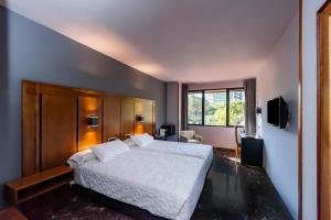 Posteľ alebo postele v izbe v ubytovaní Hotel Condestable Iranzo